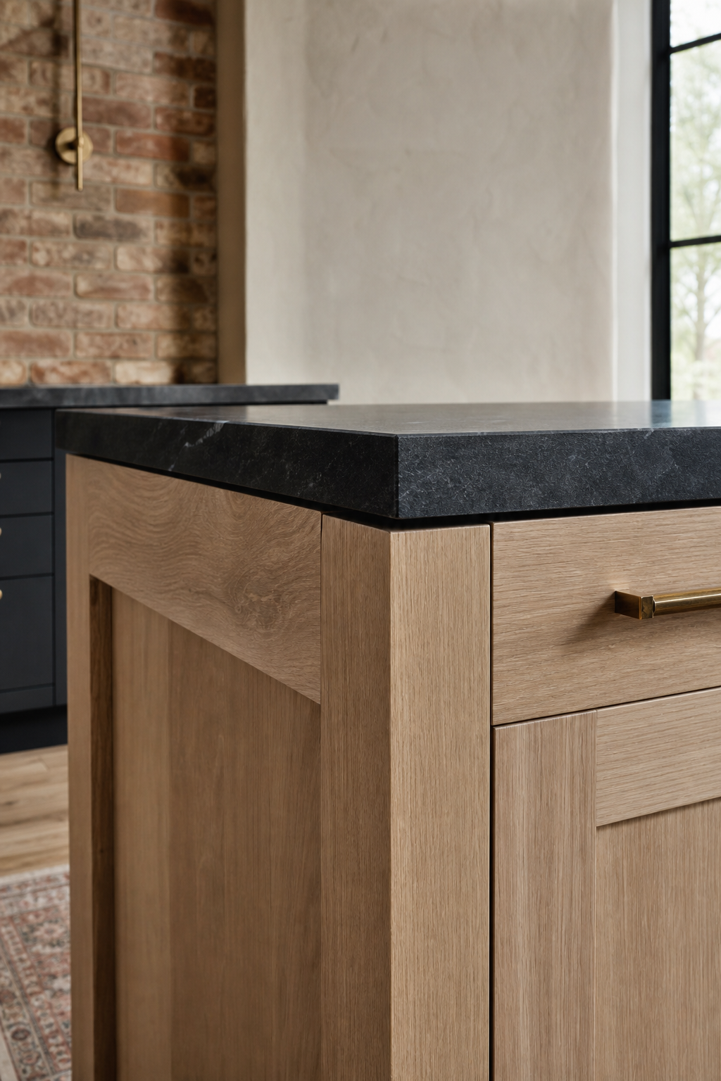 White oak cabinetry meeting a soapstone counter