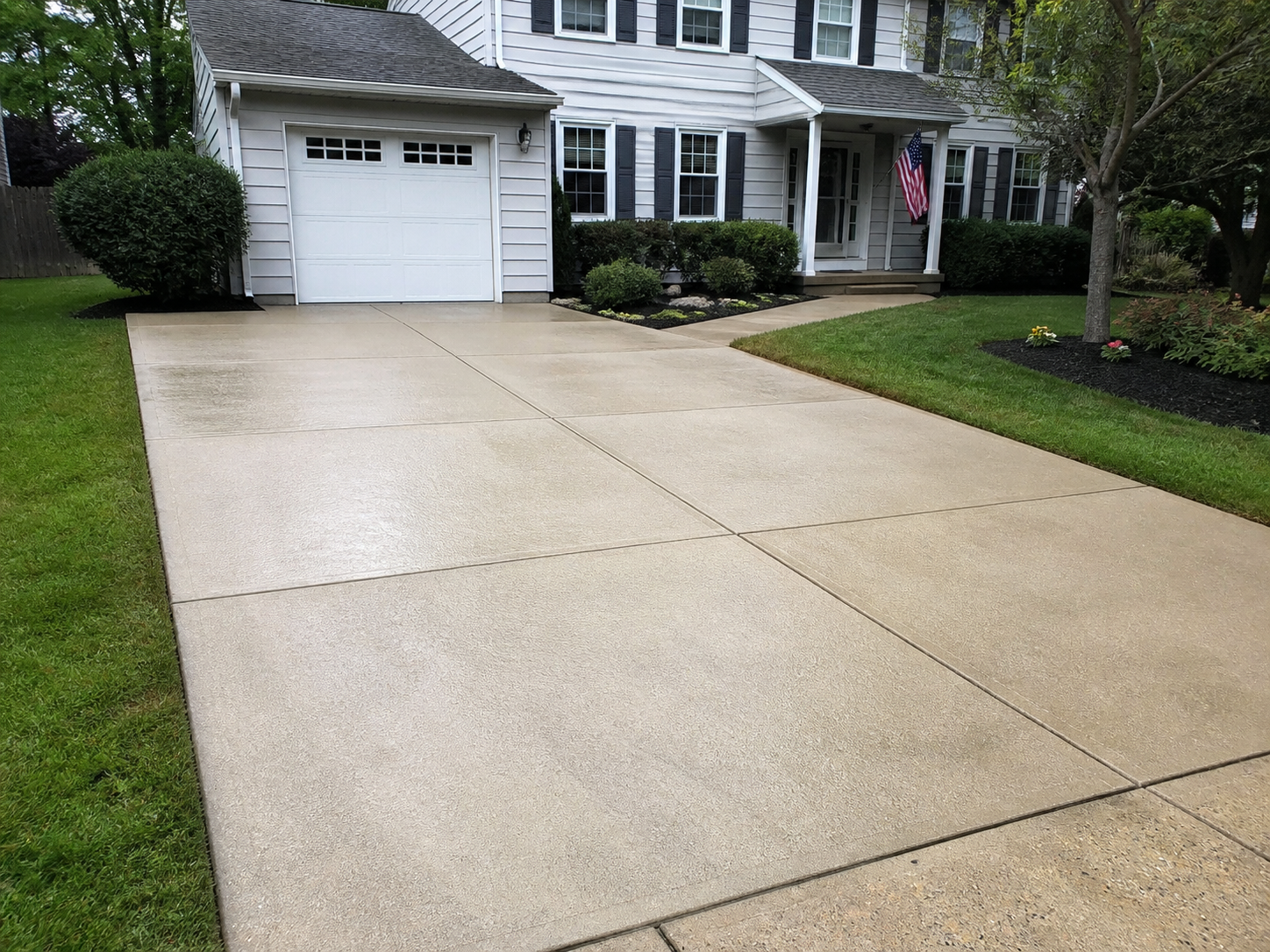 Clean driveway after pressure washing
